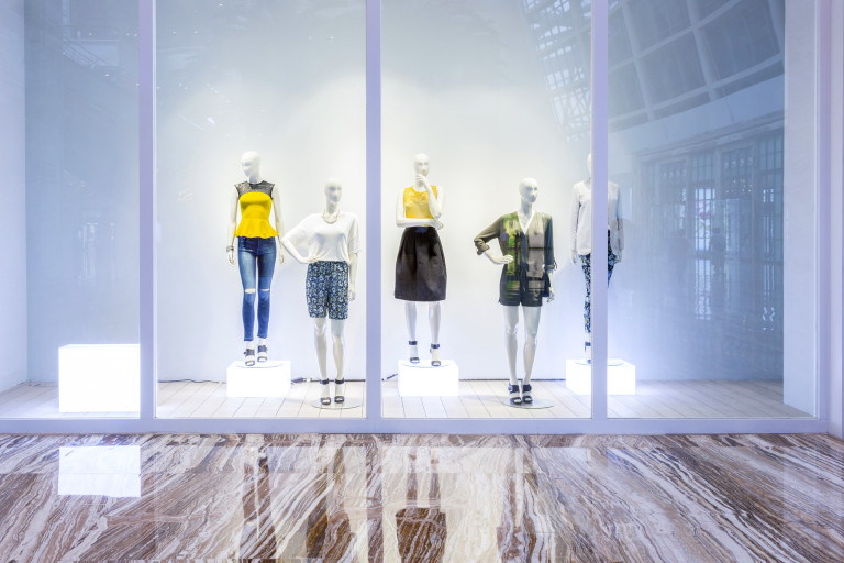 mannequins in fashion shop display window