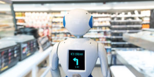 Smart retail , robot assistant service , robo advisor navigation technology in department store. Robot walk lead to guide customer to find items © JIRAROJ PRADITCHAROENKUL/GettyImages