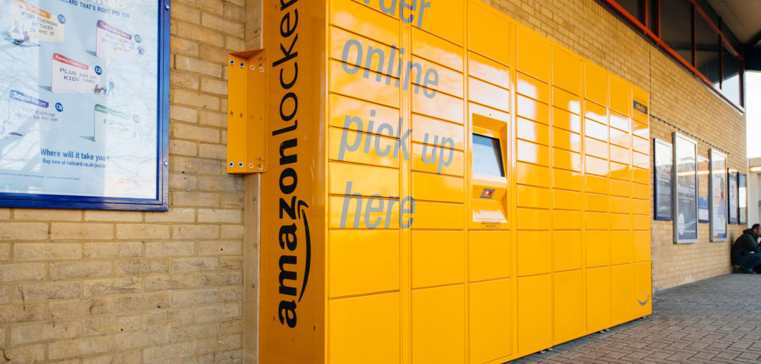 Amazon Locker yellow parcel delivery machine at train statiaon in UK © AdrianHancu/GettyImages