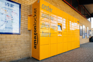 Amazon Locker yellow parcel delivery machine at train statiaon in UK © AdrianHancu/GettyImages